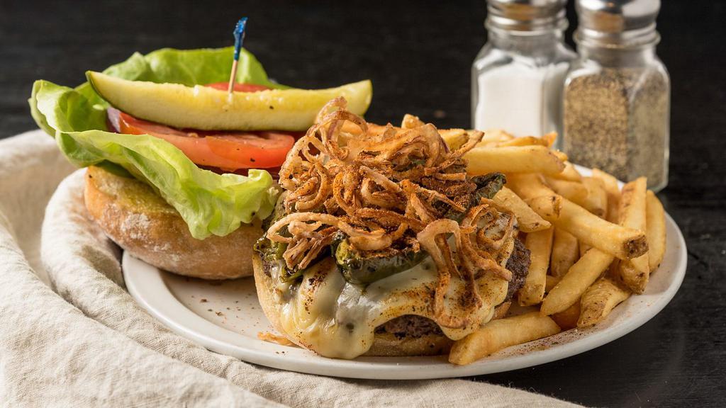 Señor Smoke Burger · Our TG Burger, Cajun-style, with pepper jack cheese, grilled jalapeños, Cajun onion strings, and spicy mayo