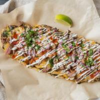 Mexican Tri-Tip Loaded Flatbread · Tri-tip, black beans, red onions, cilantro, cheddar jack cheese, salsa, sour cream and toppe...