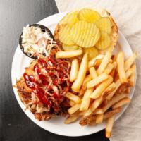 Pulled Pork Sandwich · Slow cooked pulled pork tossed in  BBQ sauce, served on a bun with a side of coleslaw and pi...