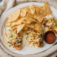 Fish Tacos · (3) Cajun grilled cod fillets topped with house coleslaw and spicy mayo on flour tortillas.