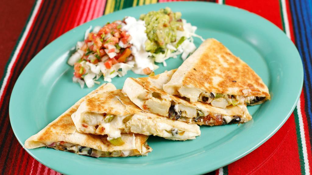 Veggie Quesadilla · Allergens dairy. A flour tortilla filled with melted cheese sauteed artichoke,  pico de gallo, bell pepper, onion, olives & garlic.  Served with cabbage, sour cream & guacamole.