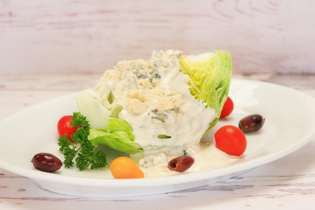 Wedge Salad · with Blue Cheese Dressing or Ranch Dressing.