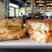 Buffalo Chicken Melt · buffalo fried chicken breast, white cheddar, bleu cheese, and pickles on sourdough served wi...