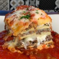 Lasagna · with beef, ricotta, mozzarella, parmigiano and meat sauce.