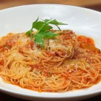 Spaghettini Pomodoro · imported italian tomatoes, garlic, basil, and olive oil.