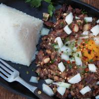 Sisig · Are you adventurous enough? Grilled diced meat (made with pork cheeks, meat, and a small amo...