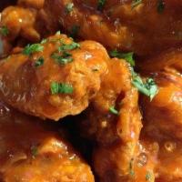 Buffalo Wings · Spicy chicken wings w/ ranch dressing (spicy sauce on side served upon request).