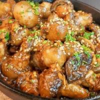 Garlic Mushrooms · Fresh button mushrooms sautéed in lots of garlic, soy sauce and spices