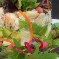 Crab & Avocado Salad · Beautifully sculptured salad with avocado, tomatoes, black olives and lettuce topped with fr...