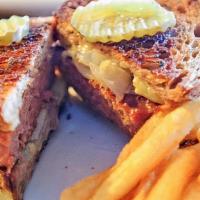 Patty Melt · 1/2 pound Angus beef w/ sautéed onions and melted Swiss cheese & pickles on rye bread with F...