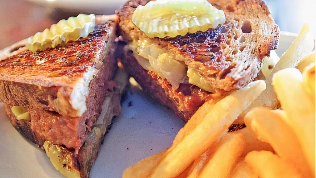 Patty Melt · 1/2 pound Angus beef w/ sautéed onions and melted Swiss cheese & pickles on rye bread with French fries.