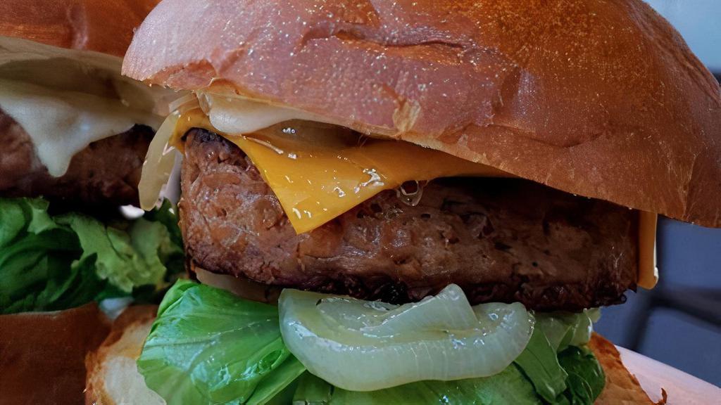 Beyond Burger · The popular plant-based burger that looks, cooks and tastes like meat! Prepared with lettuce, tomatoes, sauteed onions, mayo, pickle in a brioche bun with French fries