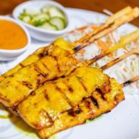1. Chicken Satay · Perfectly grilled chicken breast marinated with Thai herbs, served with cucumber salad and p...