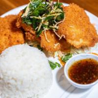 S20. Ginger Garlic Fish · Hand-battered and fried fish topped with crispy basil and ginger. Served with house-made gar...