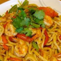 S7. Udon Pad Tom Yum · Stir fried udon with tom yum sauce, milk shrimp, egg. Baby corn, tomato, bell pepper and mus...