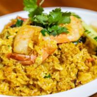 27. Khao Pad Sapparod · Pineapple fried rice with chicken, shrimps egg, onion, green onion, tomato, raisins and cash...