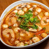 44. Tom Yum Goong · Hot and sour shrimp soup with lemongrass, onion, tomato, lime juice and mushrooms.