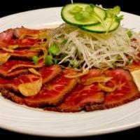 Kobe Beef Carpaccio · thinly sliced sirloin, garlic chips; ponzu sauce