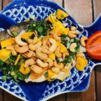 Mango Salad Fish · Deep fried fish with diced mangos, cashew nuts, red onions, green onions, shredded carrots, ...