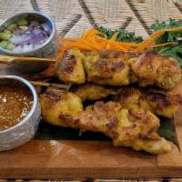 1. Satay Chicken or Beef · Served with peanut sauce and cucumber salad.