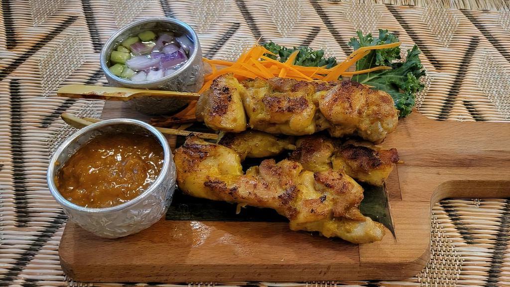 1. Satay Chicken or Beef · Served with peanut sauce and cucumber salad.