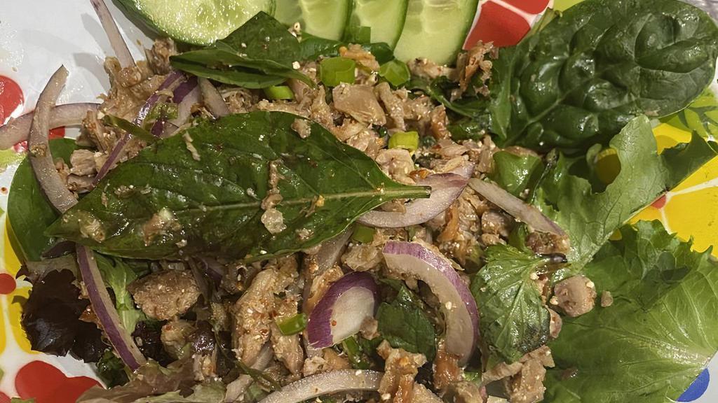 18. Larb · Choice of ground beef, chicken or pork, seasoned with spicy lime dressing, mint, onions and roasted rice powder. Served With fresh cabbage.