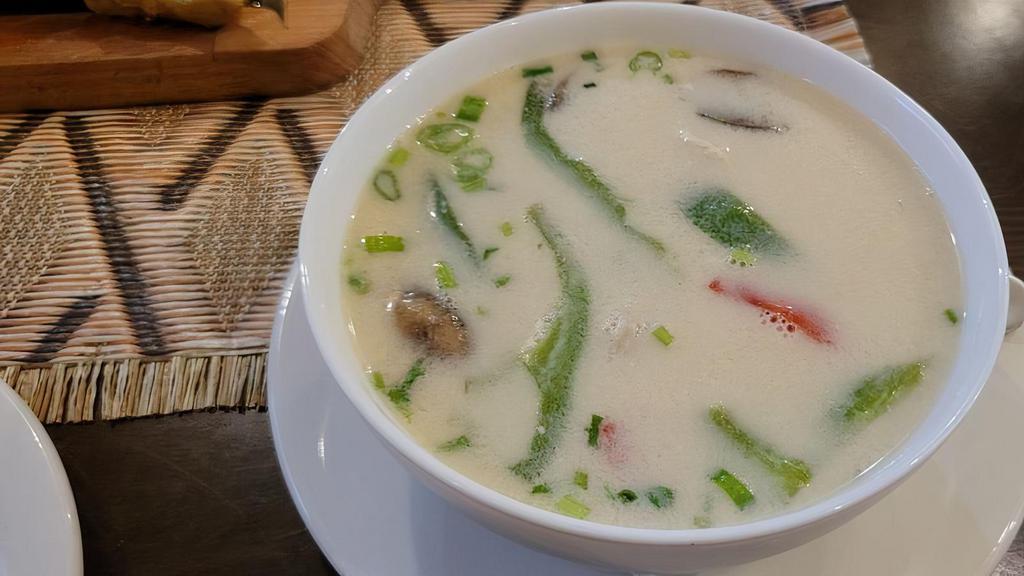 22. Tom Kha · A spicy and sour coconut milk with flavor of galanga, lemongrass, kaffir lime leaves and a choice of chicken, seafood combo or mushrooms.