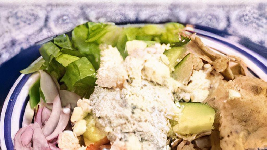 Chicken Gyro Bowl · Marinated chicken gyro meat served with rice, lettuce, cucumbers, tomatoes, onions, feta and tzatziki.