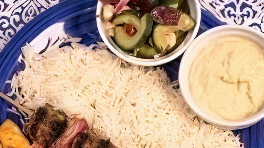 Chicken Kebob 2 Skewer Meal · Served with basmati rice, Greek salad and a side of hummus.