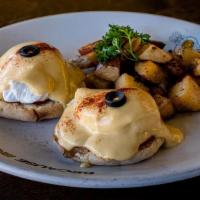 Eggs Benedict with Smoked Salmon · Benedict with Salmon. English muffin topped with poached eggs, smothered with hollandaise sa...