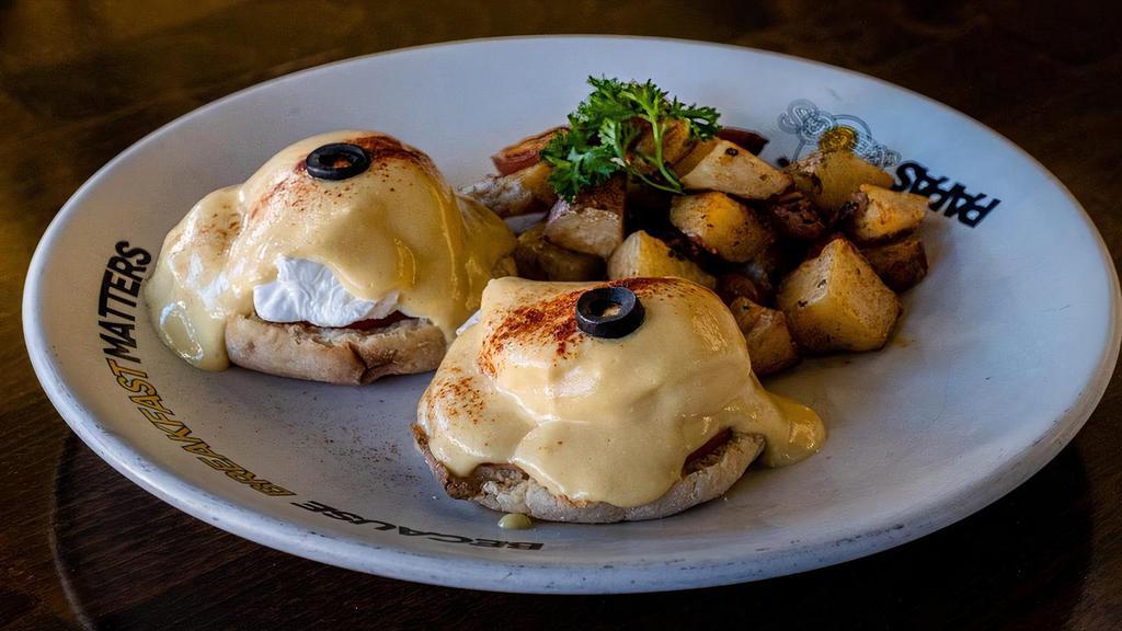 Eggs Benedict with Smoked Salmon · Benedict with Salmon. English muffin topped with poached eggs, smothered with hollandaise sauce, served with roasted potatoes.