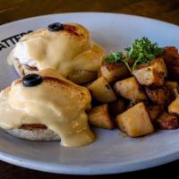 Eggs Benedict Canadian-bacon · Benedict with Canadian-bacon. English muffin topped with poached eggs, smothered with hollan...