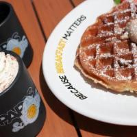 Buttermilk Waffles · Our traditional golden brown Belgian waffle topped with whipped real butter!