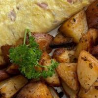 Ham Omelette · One of our customer's favorites. Back to Basics, with a mexican touch. Ham and Monterrey che...