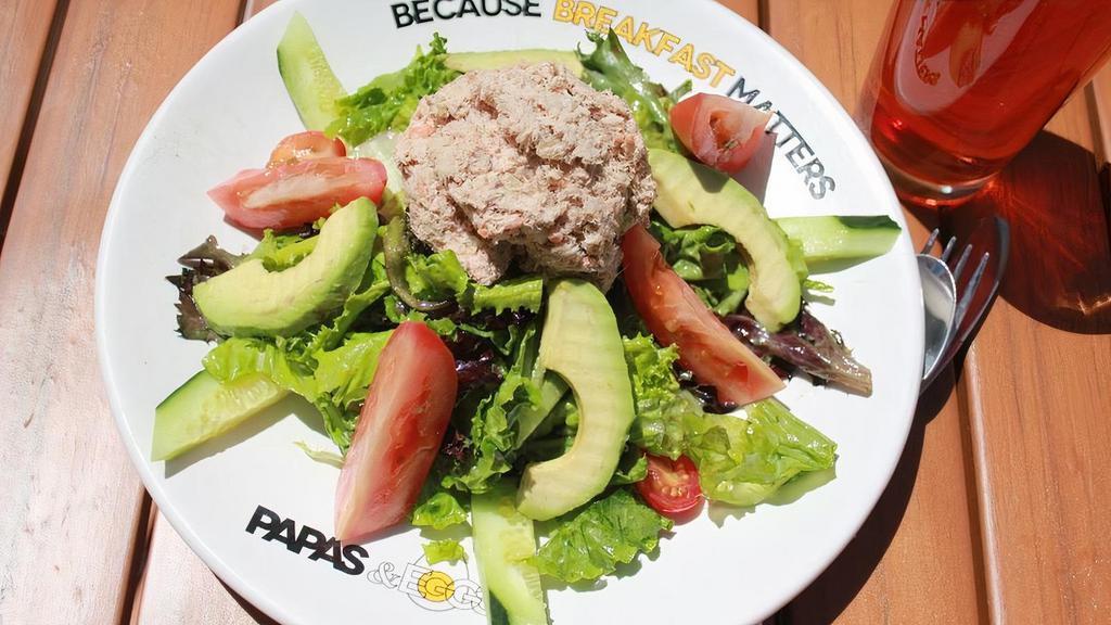 Tuna Avocado Salad · Fresh mixed greens, avocado, tuna, Roma tomatoes, cucumbers, and our special house dressing.
