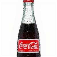 Mexican Bottle Coca Cola · Mexican Coke uses natural cane sugar, and even if it has the same number of calories and rea...