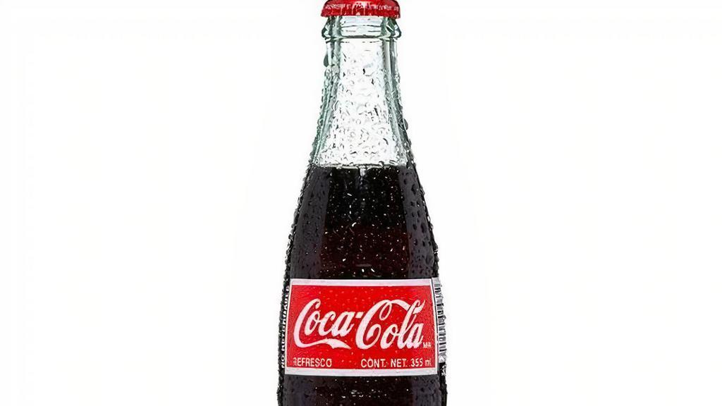 Mexican Bottle Coca Cola · Mexican Coke uses natural cane sugar, and even if it has the same number of calories and really isn't healthier than high fructose corn syrup — it just tastes better!