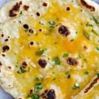 Garlic & Cheese Naan · Clay-oven baked Indian Naan with mashed garlic, cheese and coriander