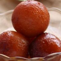 Gulab Jamun · Juicy milk balls dipped in honey syrup rice in thick milk with almonds, nuts, and raisins