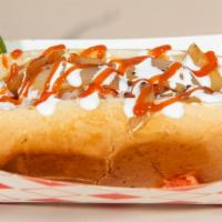 Mexican Style Hot Dog · Bun, bacon wrapped hot dog, sour cream, ketchup, tomato, raw onion, grilled onions, and hot ...