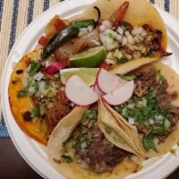 Regular Taco · Top Menu Item. Tortilla de maiz, choice of meat, onion, cilantro, salsa, lime, and house-mad...