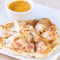 Roti Parata with Curry Sauce · Vegetarian. Grilled Indian style multi-layered bread. Served with vegetarian curry dipping s...