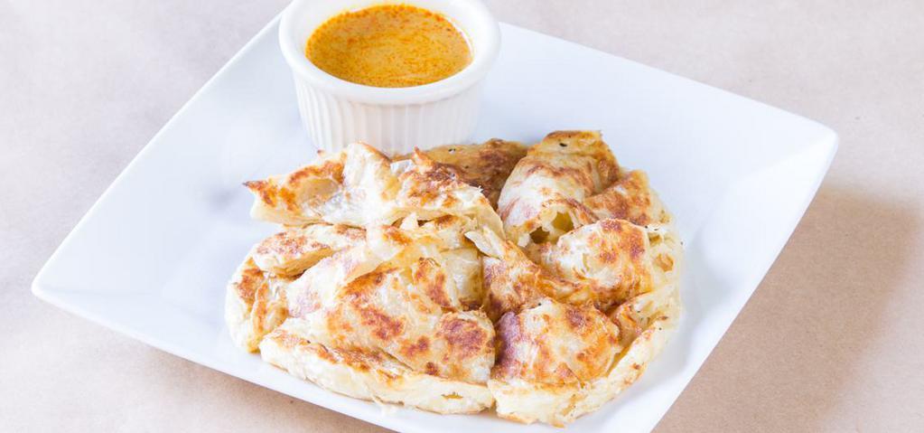 Roti Parata with Curry Sauce · Vegetarian. Grilled Indian style multi-layered bread. Served with vegetarian curry dipping sauce.