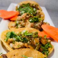 Tacos · Choice of meat, onion, cilantro and salsa.