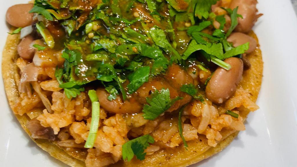 Veggie Taco · Rice, pinto beans, onions, cilantro and salsa.