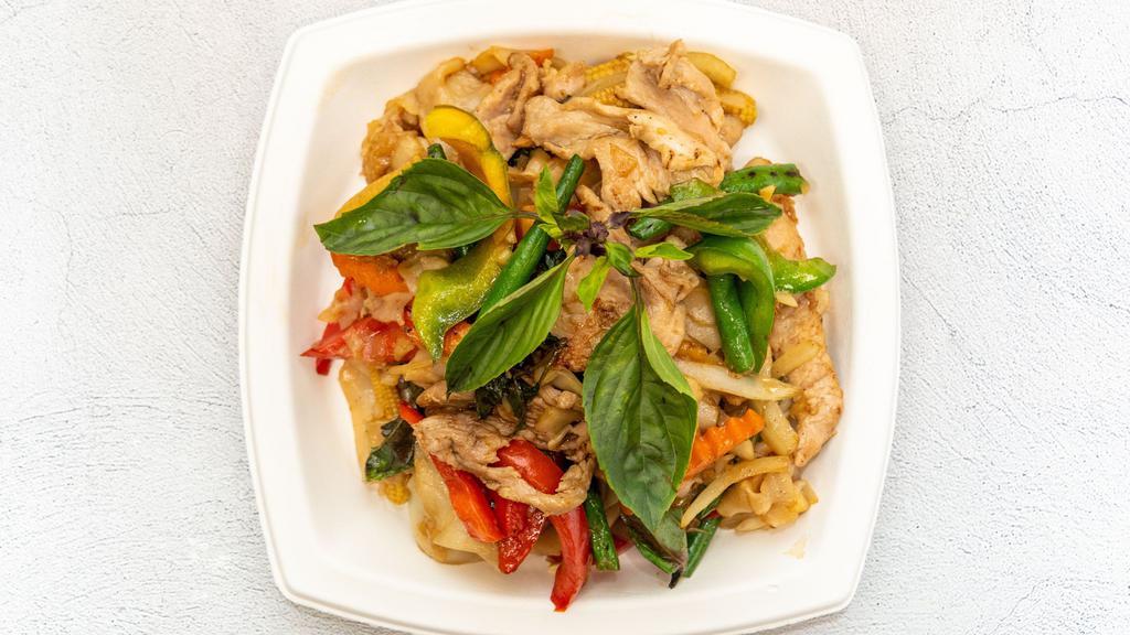 Drunken Noodles · Our signature wide rice noodles with baby corn, green bean, bell pepper, garlic, chili, onion, and Thai basil.