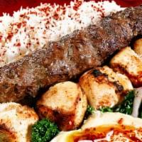 Lamb Shish Plate · Charbroiled grilled skewered cubes meat or veggie served with rice, house salad, hummus, pit...