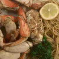 Garlic Crab & Noodles · 1/2 whole crab boiled with garlic butter with a hint of cajun seasoning with a side of garli...