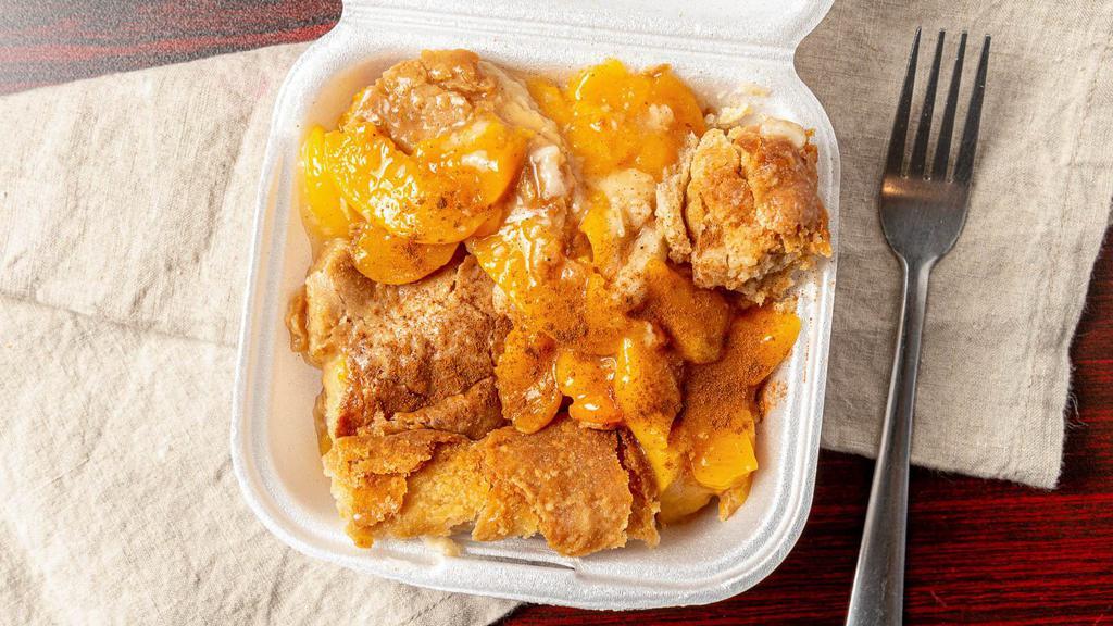 Peach Cobbler · Sweet homemade dessert baked with ripe peaches and thick golden crust.
