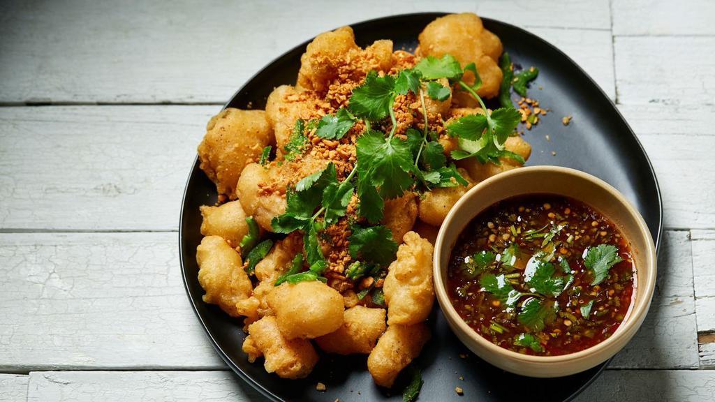 Salt & Pepper Chicken/Calamari · Lightly battered and fried with peppers and scallions.
